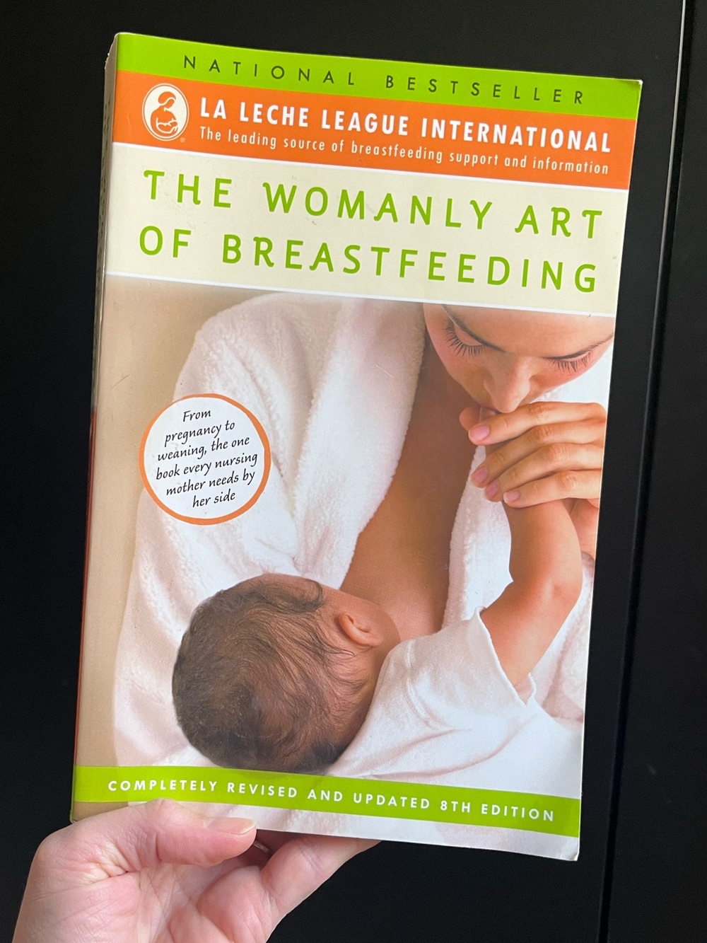 La Leche League The womanly Art of Breastfeeding guide book.